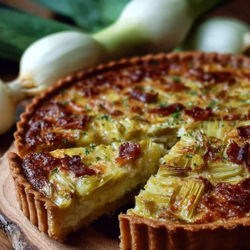 Tarte aux poireaux façon grand-mère, un plat traditionnel savoureux et réconfortant.