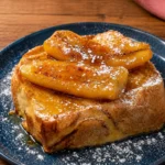 Pain perdu à la banane flambée, un dessert délicieux et réconfortant.